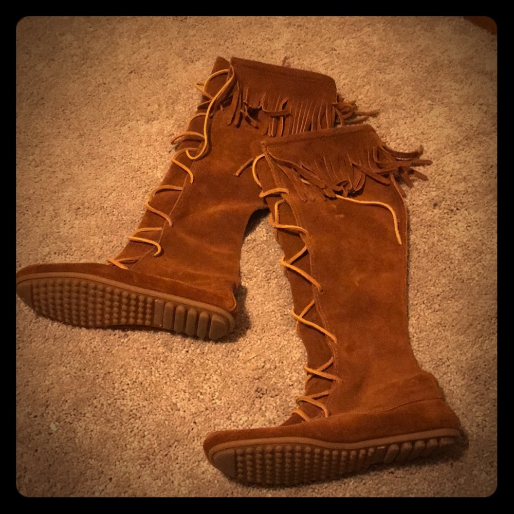 Knee high, suede, lace up Minnetonka boots.